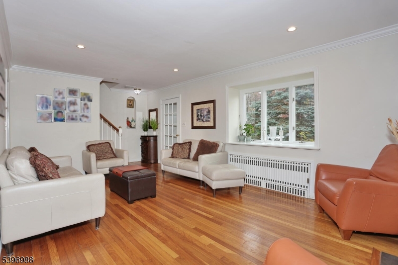 12 Pershing Avenue Ridgewood, NJ 07450 - Photo 7 of 42 a living room with furniture and a window