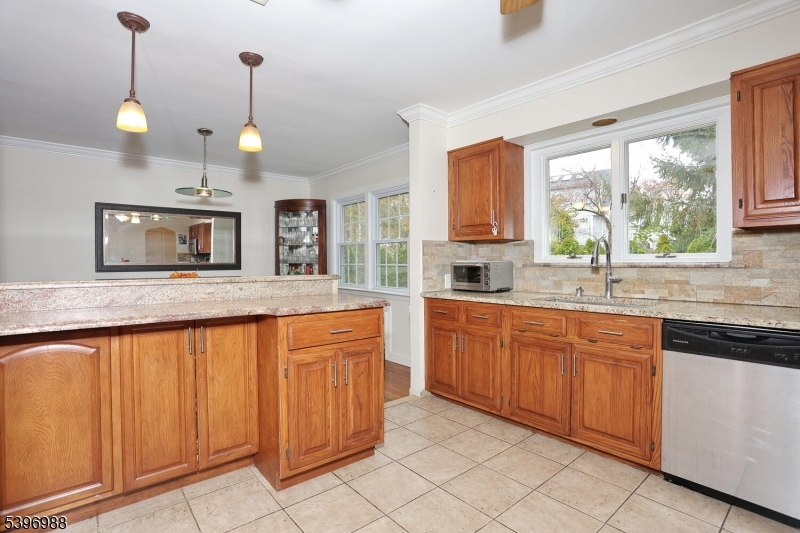 12 Pershing Avenue Ridgewood, NJ 07450 - Photo 10 of 42 a large kitchen with granite countertop a stove a sink and a granite counter tops