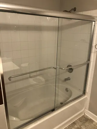 an empty room with a bathroom and a sink