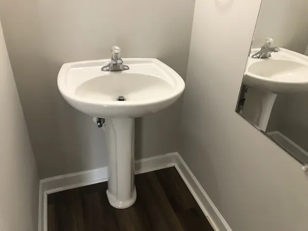 a bathroom with a sink and mirror