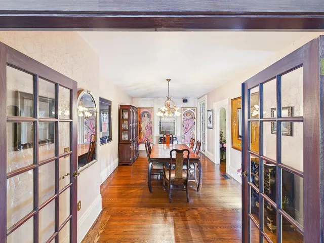 a dining room with furniture and chandelier