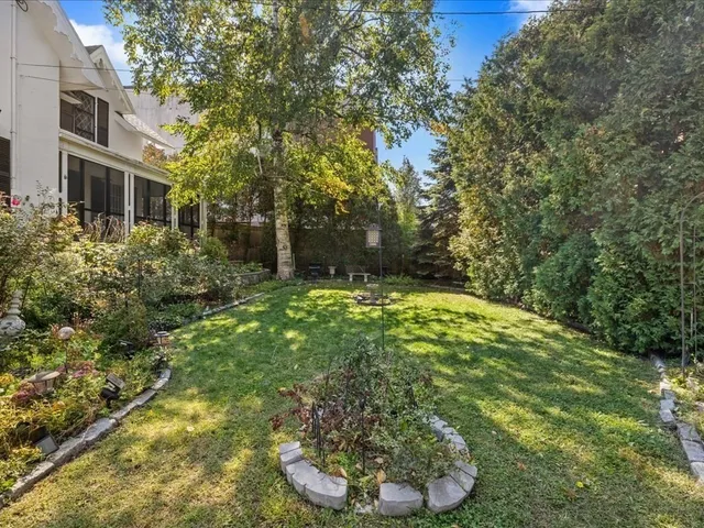 a backyard of a house with lots of green space