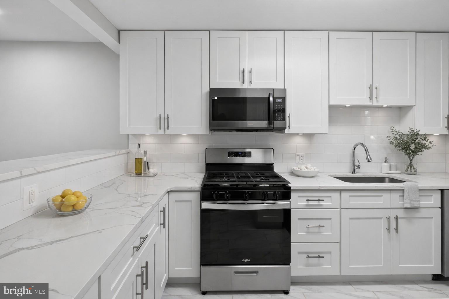 10114 Oakton Terrace Road Oakton, VA 22124 - Photo 1 of 1 a kitchen with white cabinets and appliances