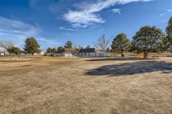 a view of a yard with an outdoor space