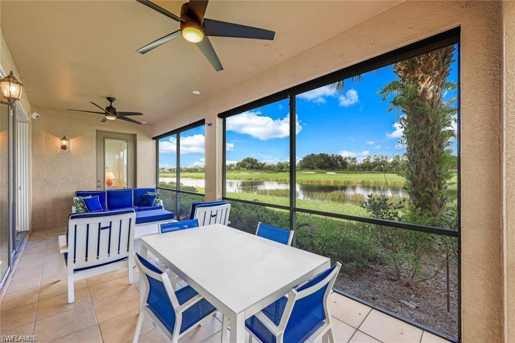 9525 Ironstone Terrace, Unit 102 Naples, FL 34120 - Photo 19 of 35 a view of a dining room with furniture window and wooden floor