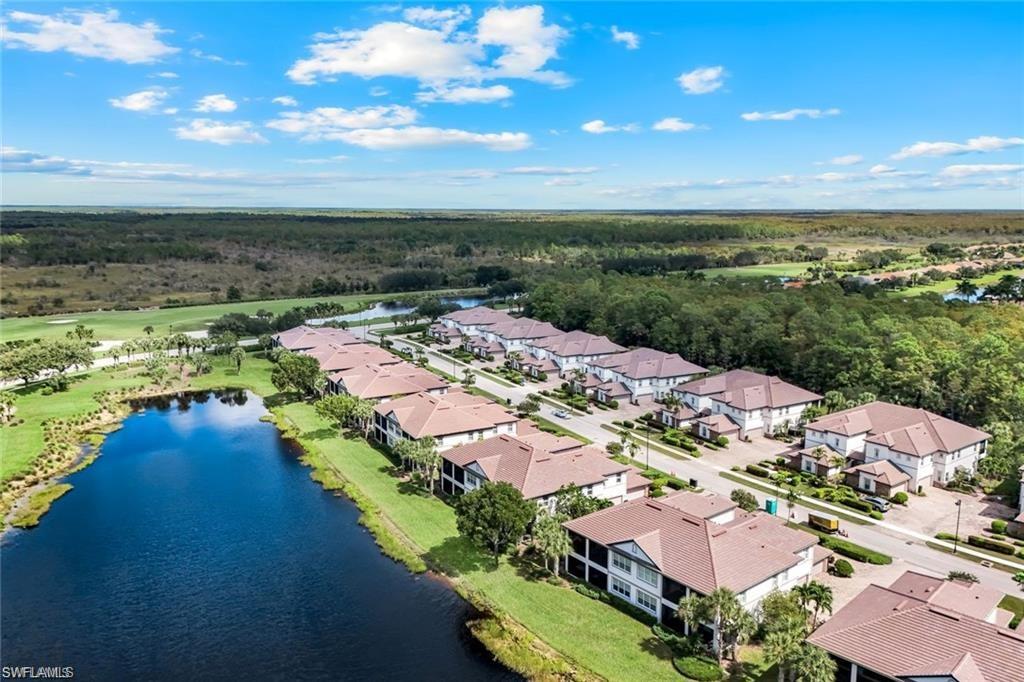 9525 Ironstone Terrace, Unit 102 Naples, FL 34120 - Photo 23 of 35 an aerial view of residential houses with outdoor space