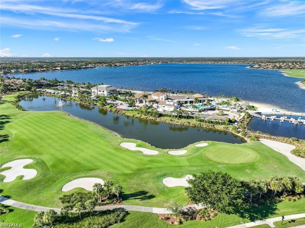 9525 Ironstone Terrace, Unit 102 Naples, FL 34120 - Photo 27 of 35 a view of a lake with a mountain