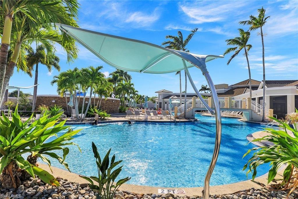 9525 Ironstone Terrace, Unit 102 Naples, FL 34120 - Photo 28 of 35 a view of a swimming pool with a patio