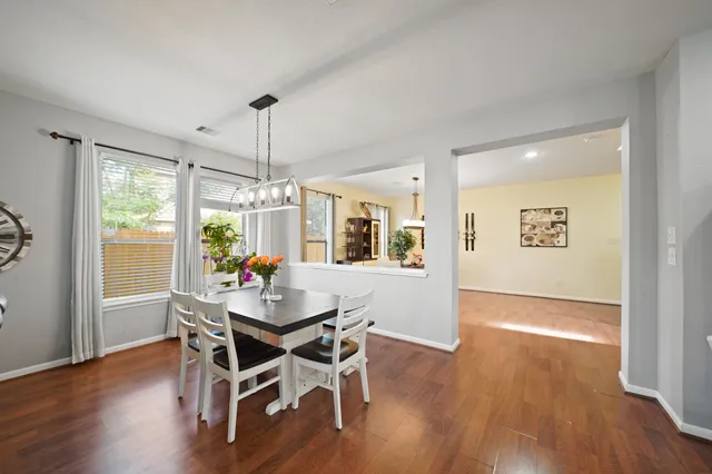 a dining room with furniture window wooden floor