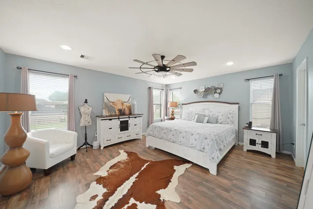 a bedroom with a bed and a couch