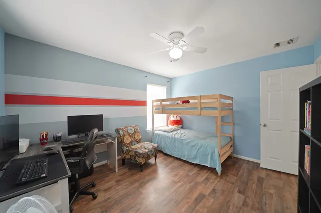 a room with furniture and a flat screen tv