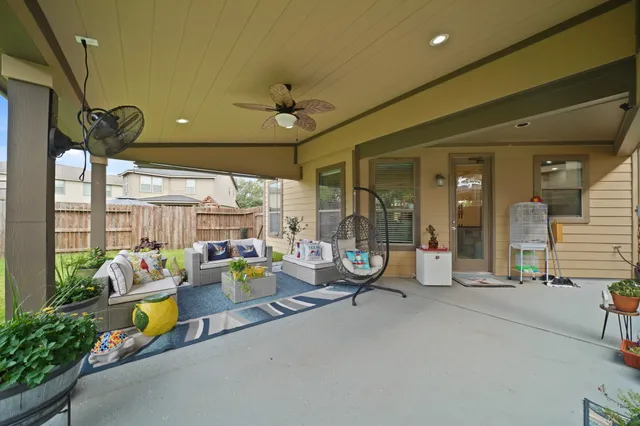 a view of a patio with a table and chairs