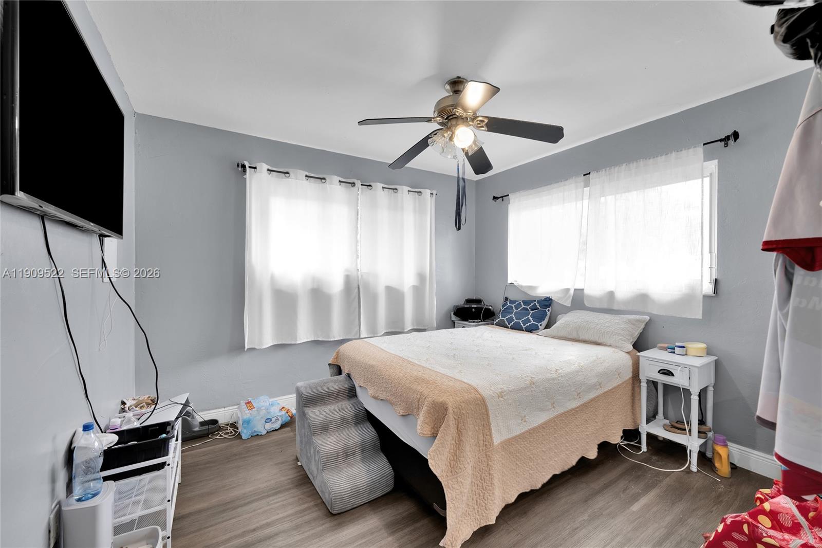 6221 Southwest 26th Street Miramar, FL 33023 - Photo 11 of 24 a bedroom with a bed tv and a window