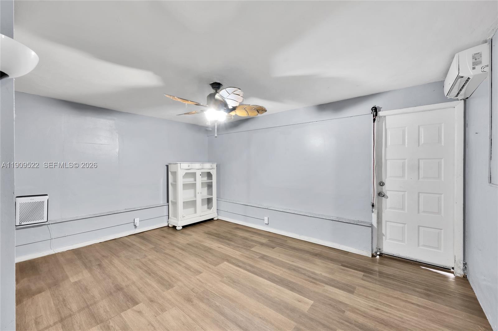 6221 Southwest 26th Street Miramar, FL 33023 - Photo 16 of 24 an empty room with wooden floor and window