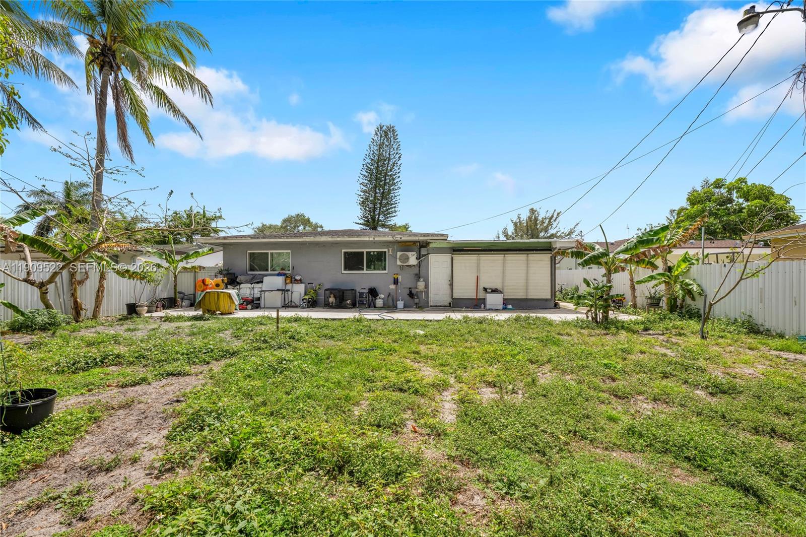 6221 Southwest 26th Street Miramar, FL 33023 - Photo 19 of 24 a front view of a house with a yard