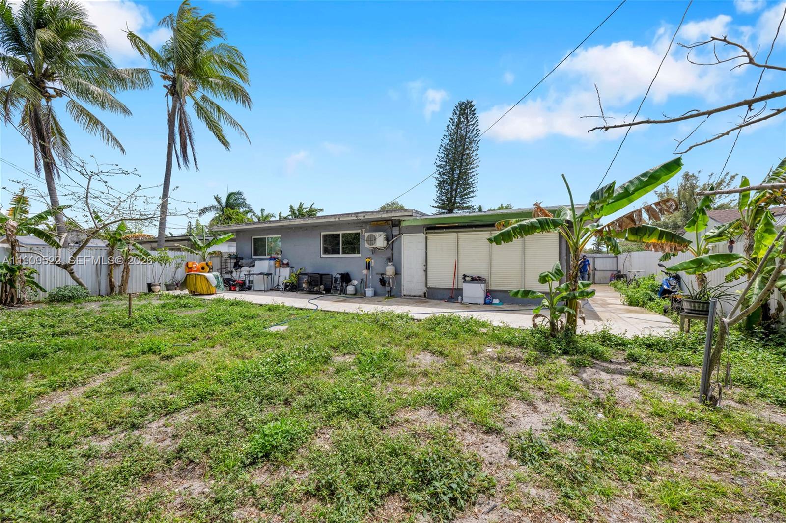 6221 Southwest 26th Street Miramar, FL 33023 - Photo 22 of 24 a view of a house with backyard and a tree