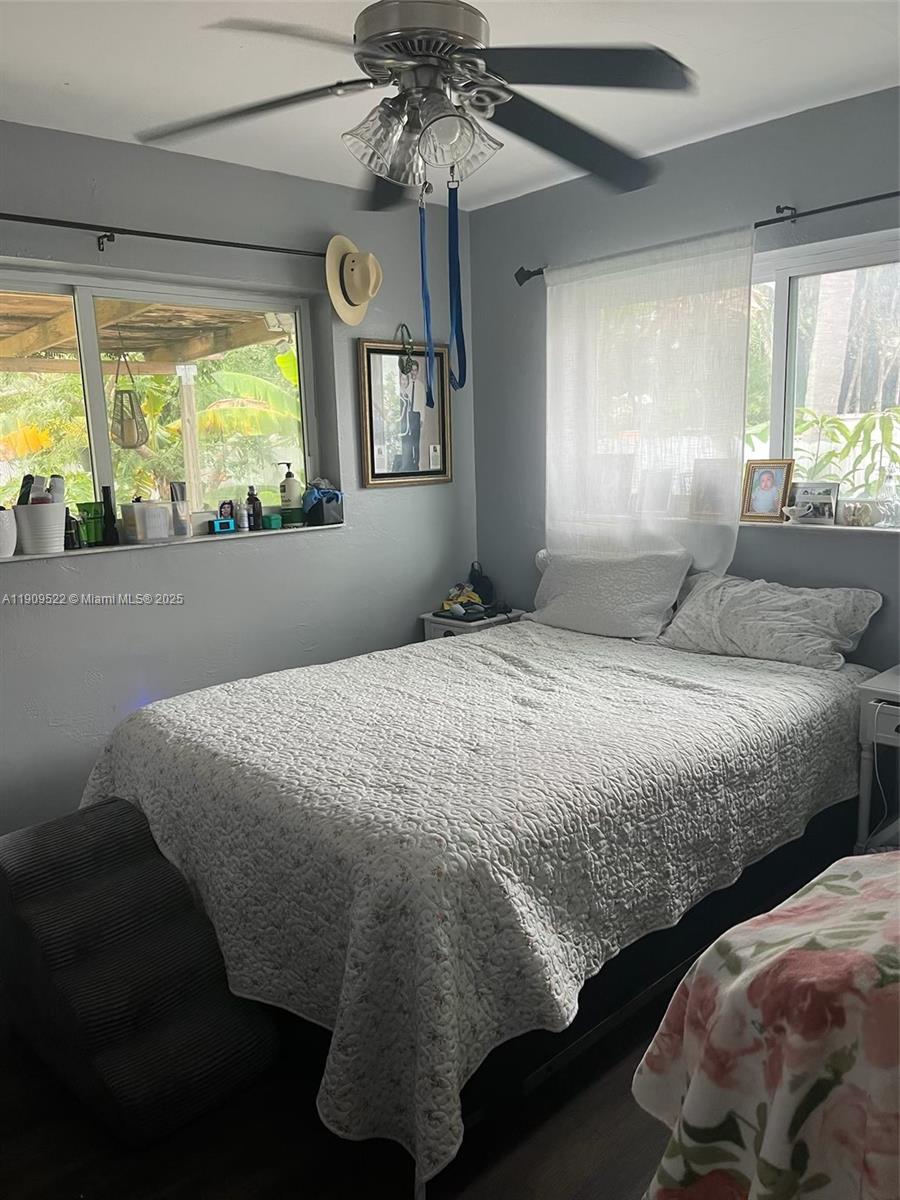 6221 Southwest 26th Street Miramar, FL 33023 - Photo 4 of 12 a bedroom with a large bed and a window