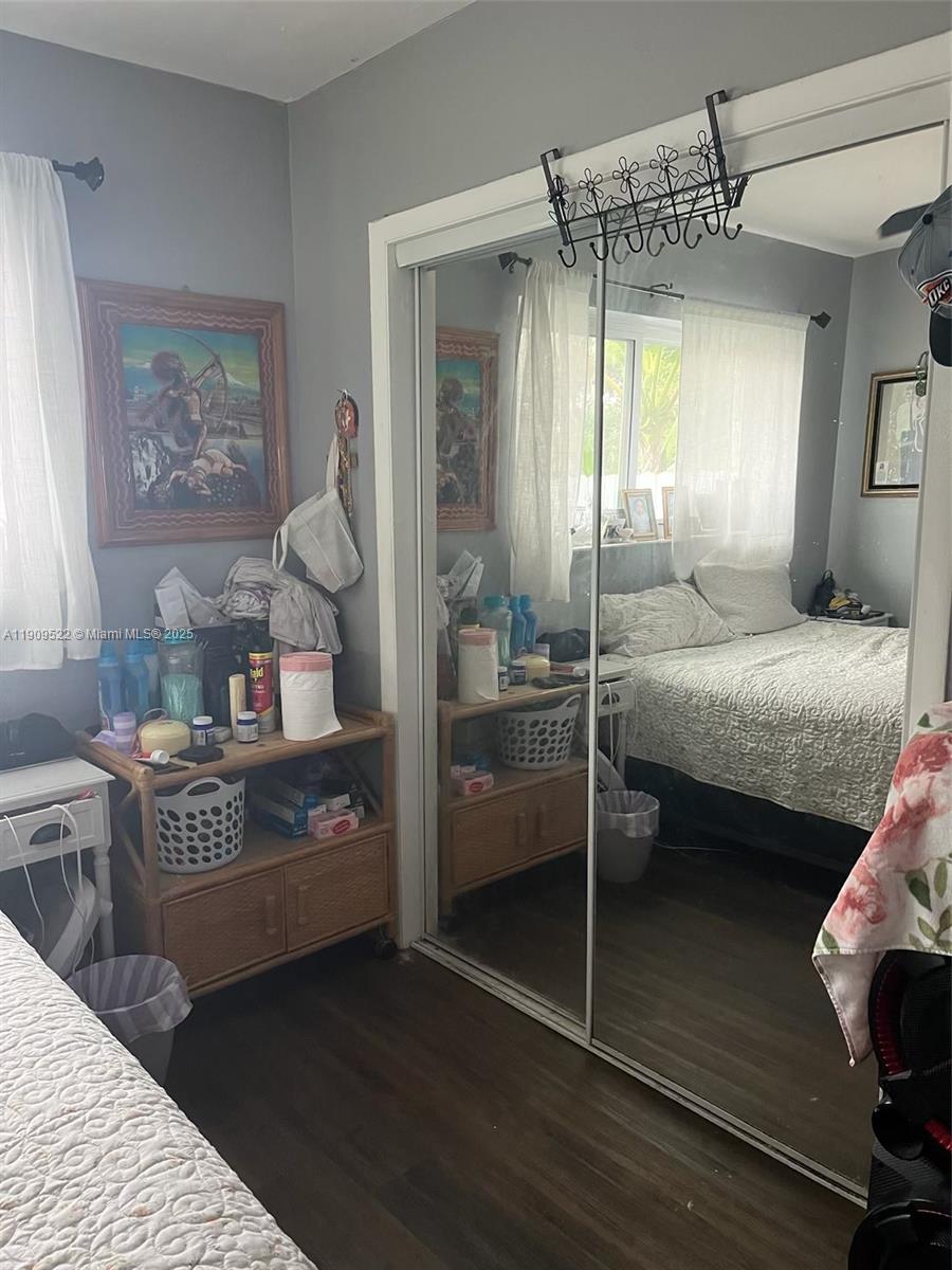 6221 Southwest 26th Street Miramar, FL 33023 - Photo 5 of 12 a bedroom with a bed and a mirror