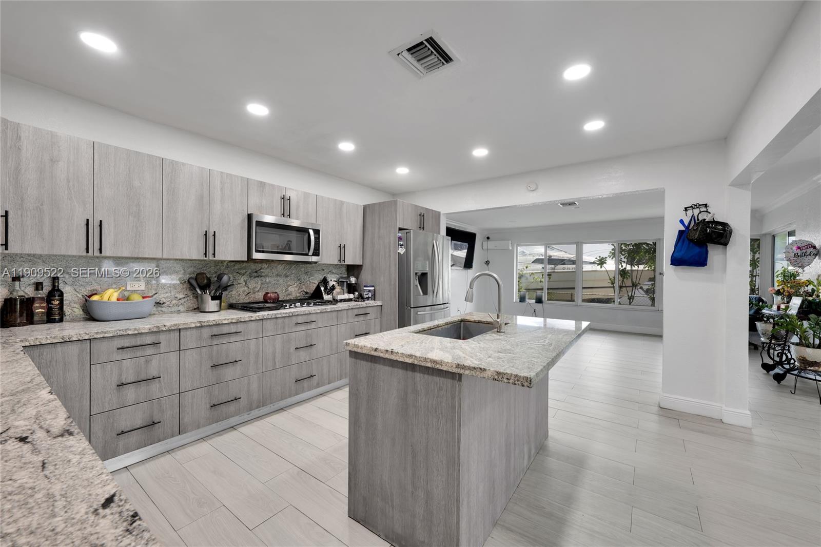 6221 Southwest 26th Street Miramar, FL 33023 - Photo 5 of 24 a kitchen with stainless steel appliances granite countertop lots of counter top space