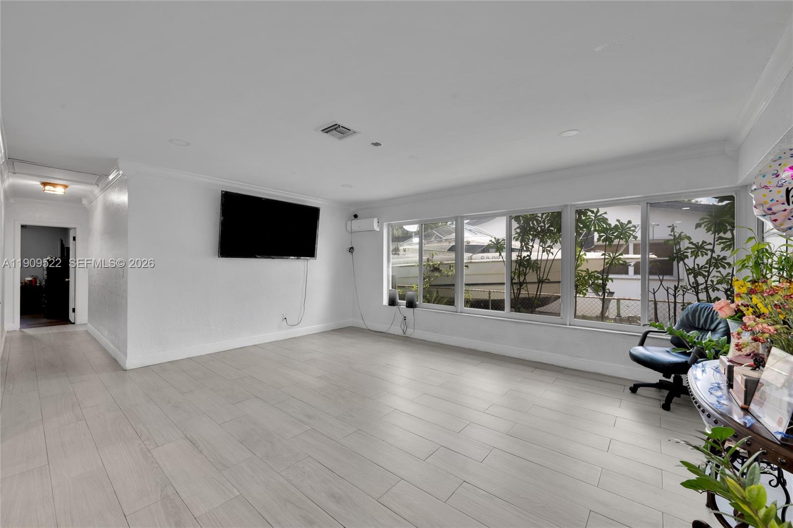 6221 Southwest 26th Street Miramar, FL 33023 - Photo 6 of 24 a view of a livingroom with a flat screen tv