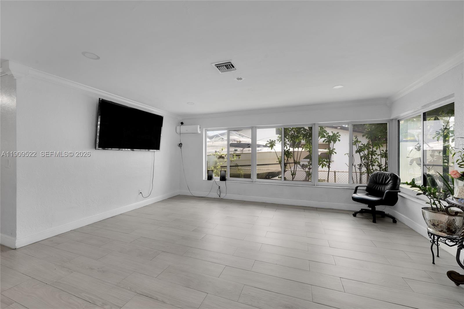 6221 Southwest 26th Street Miramar, FL 33023 - Photo 7 of 24 a view of a livingroom with furniture and a flat screen tv