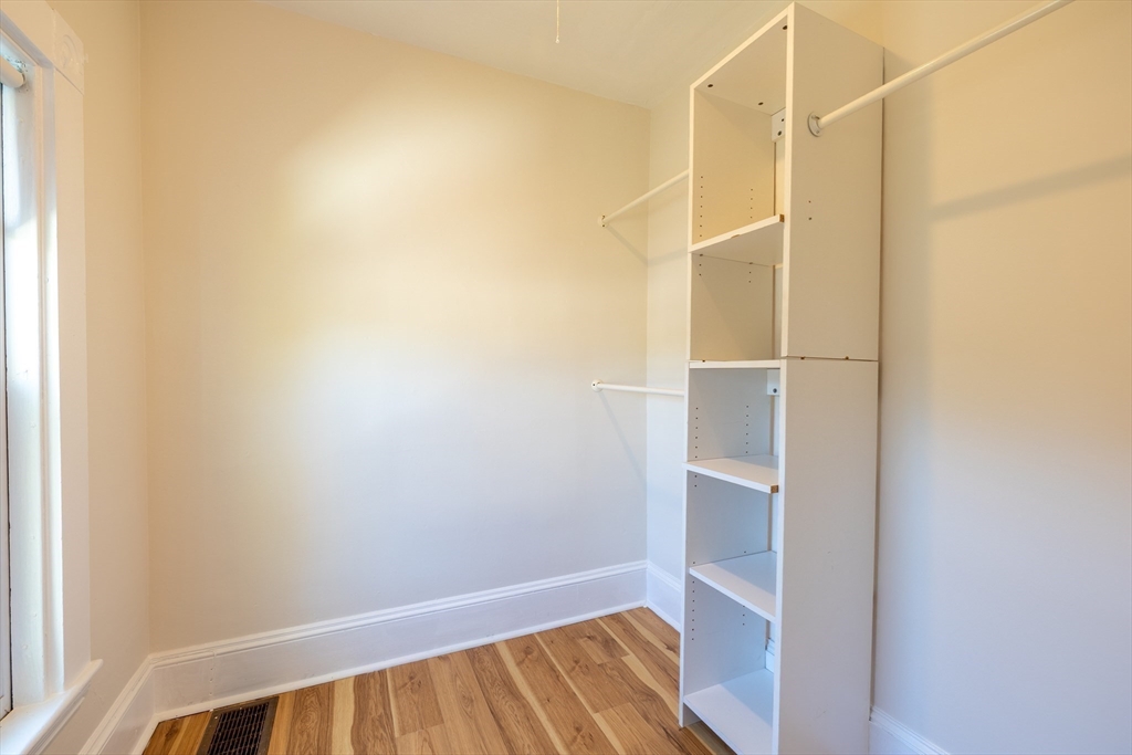 365 Whiting Avenue, Unit 2 Dedham, MA 02026 - Photo 14 of 15 a view of an empty walk in closet