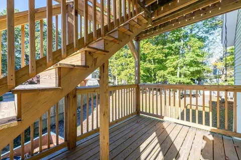 a view of balcony with wooden floor