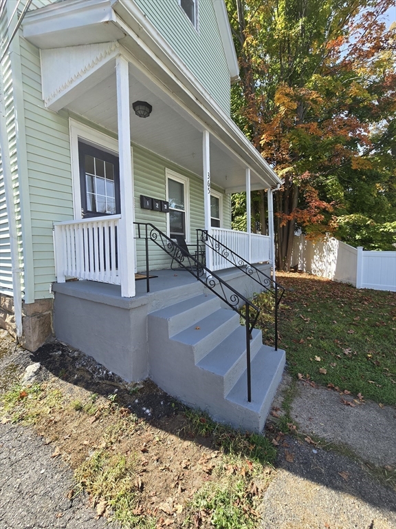 365 Whiting Avenue, Unit 2 Dedham, MA 02026 - Photo 2 of 15 a front view of a house with garden