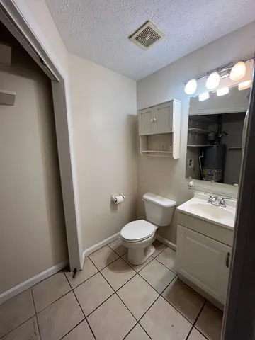 a backyard of a house with a tree