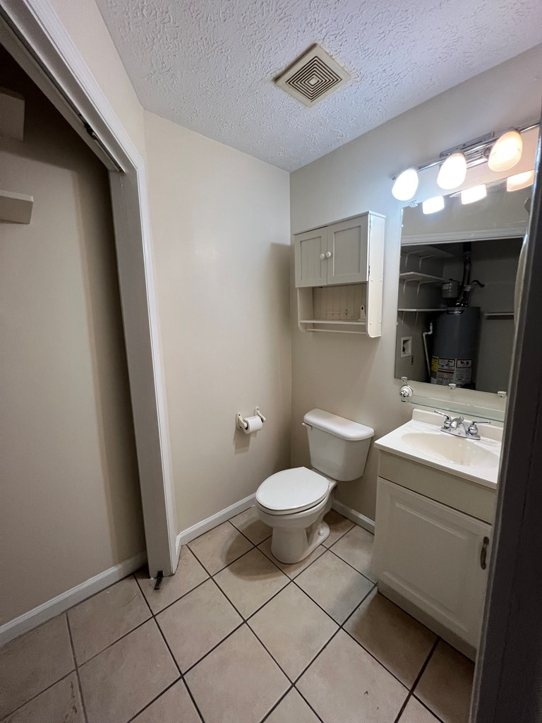 3447 Montecello Drive Columbus, GA 31906 - Photo 10 of 11 a bathroom with a toilet sink and mirror