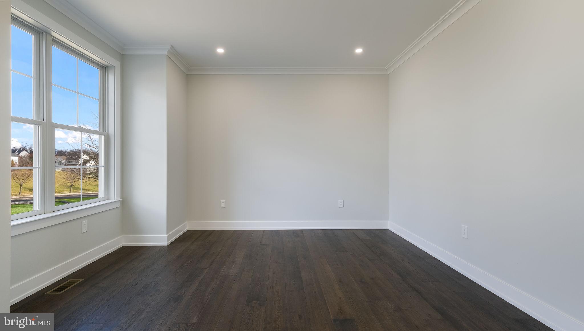 2550 Rickert Road Perkasie, PA 18944 - Photo 7 of 73 a view of an empty room with wooden floor and a window