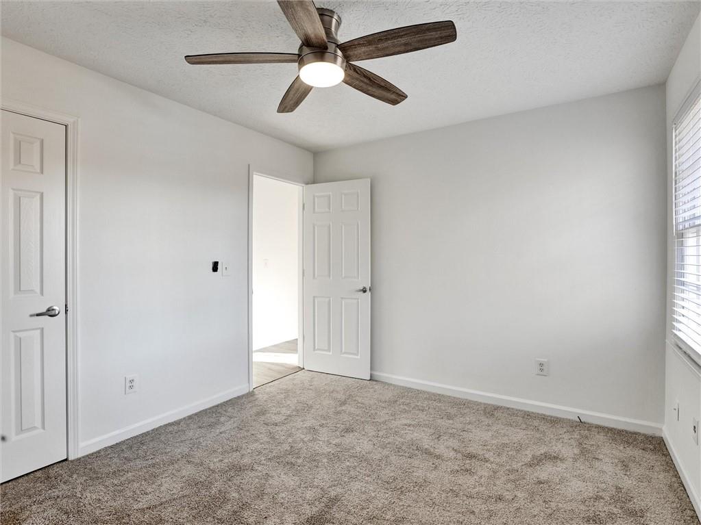 7115 Spout Springs Road Flowery Branch, GA 30542 - Photo 7 of 20 wooden floor in an empty room