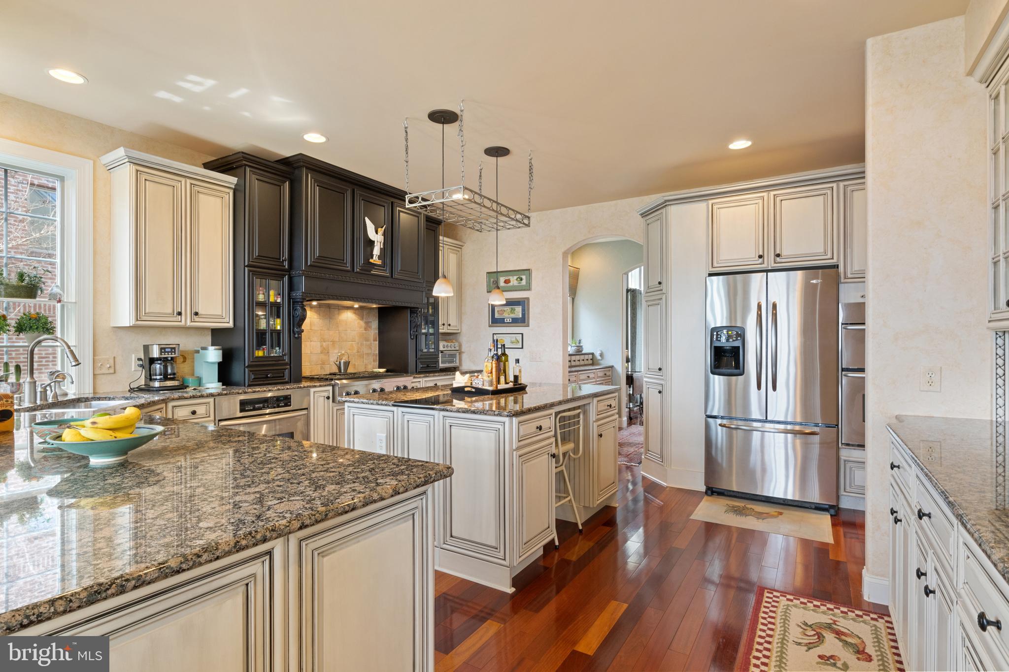 108 Valmere Path York, PA 17403 - Photo 20 of 84 a kitchen with stainless steel appliances granite countertop a refrigerator a stove top oven a sink and cabinets