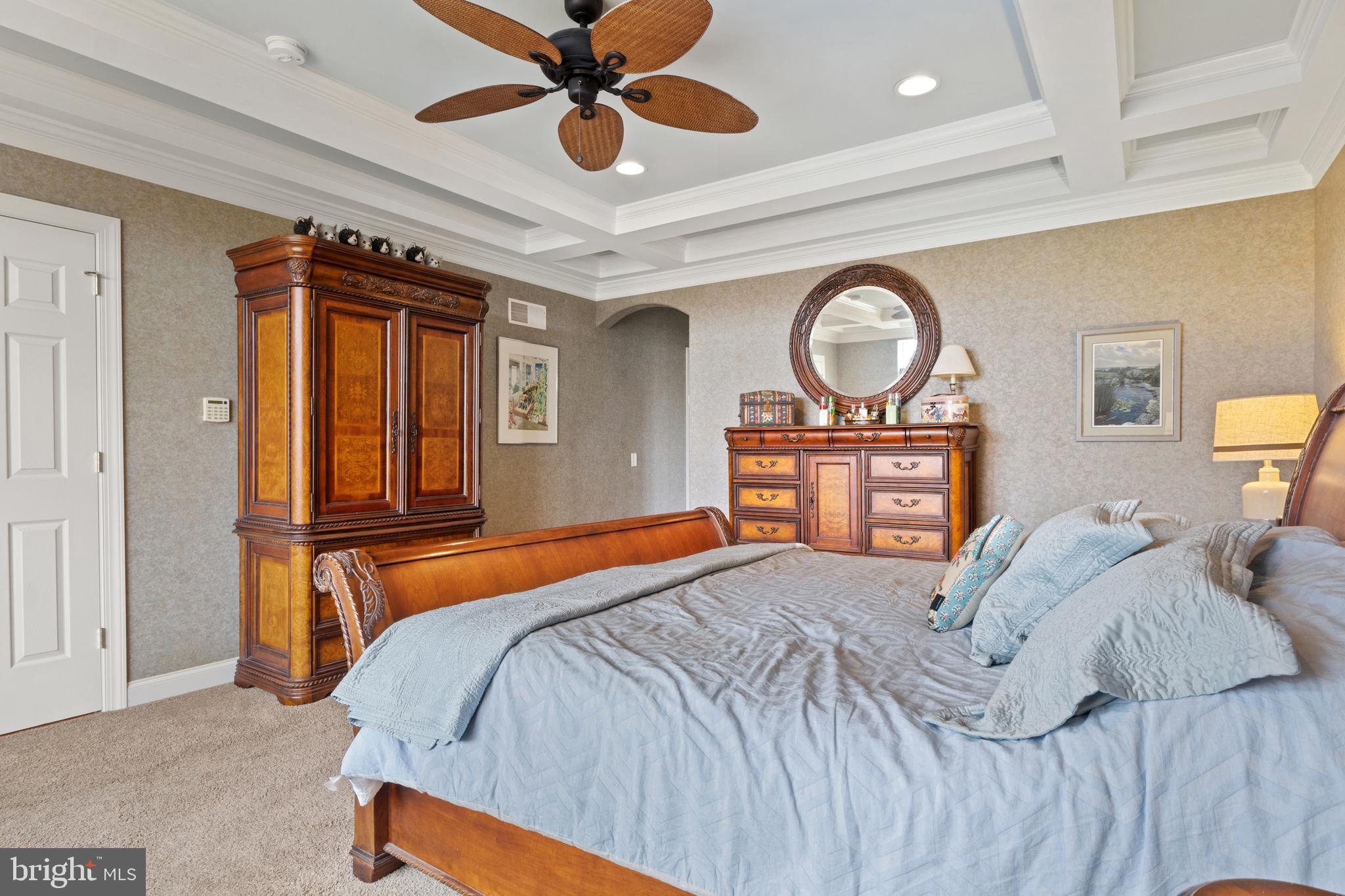 108 Valmere Path York, PA 17403 - Photo 35 of 84 a bedroom with a bed and a large mirror with a chandelier