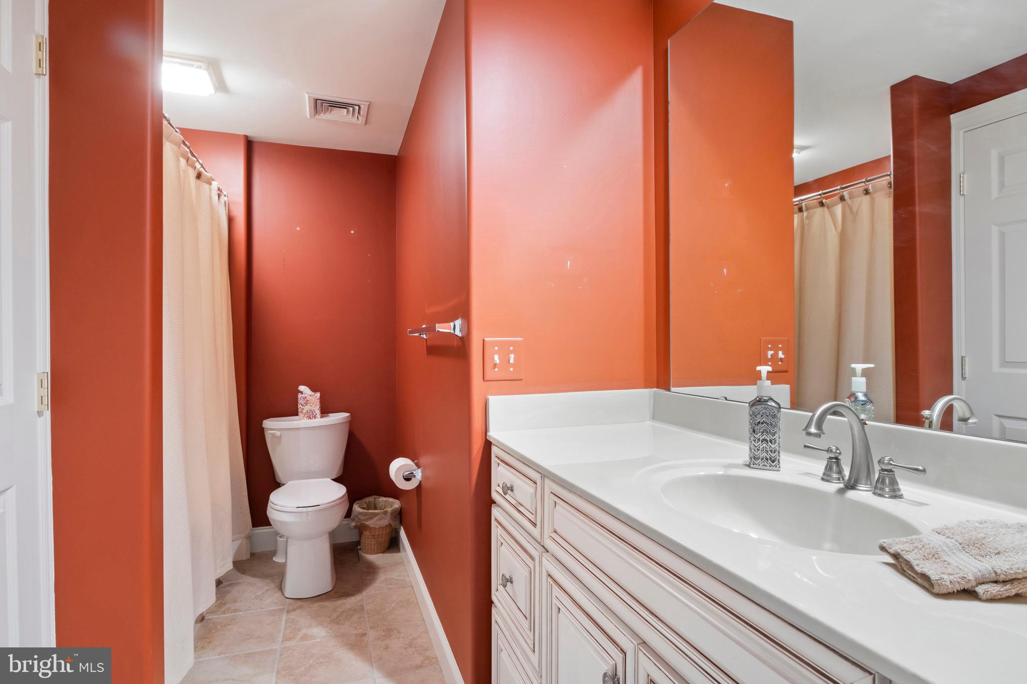 108 Valmere Path York, PA 17403 - Photo 58 of 84 a bathroom with a granite countertop sink a toilet and a large mirror