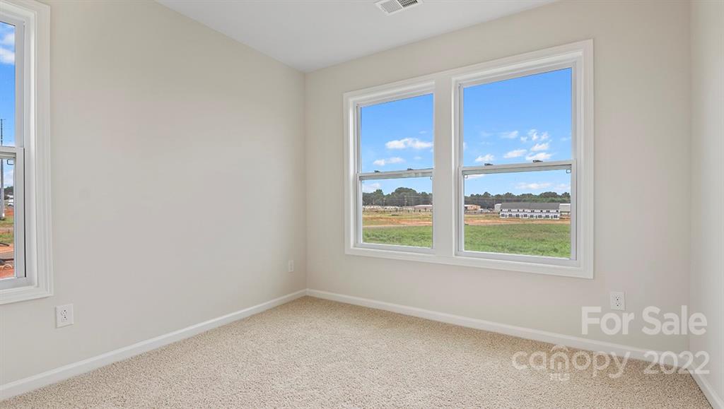 70 Creekview Road Hendersonville, NC 28792 - Photo 20 of 27 an empty room with a window