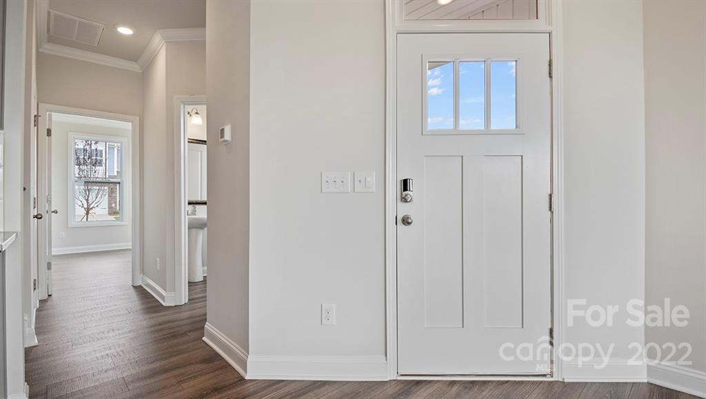 70 Creekview Road Hendersonville, NC 28792 - Photo 4 of 27 a view of a hallway with wooden floor