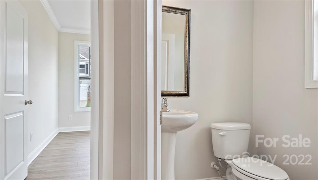 70 Creekview Road Hendersonville, NC 28792 - Photo 5 of 27 a white toilet sitting next to a bathroom sink