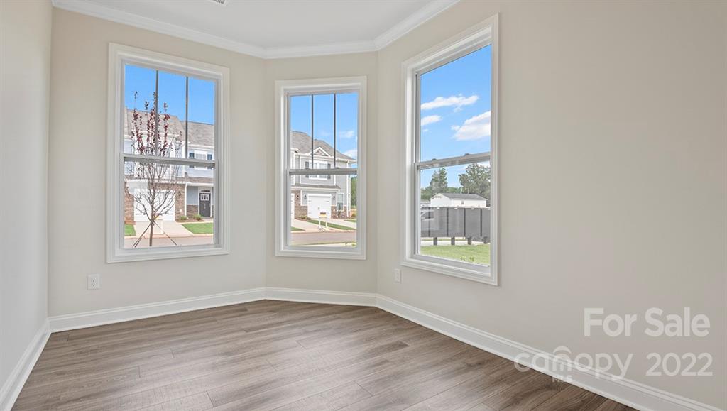 70 Creekview Road Hendersonville, NC 28792 - Photo 7 of 27 a view of an empty room with wooden floor and a window