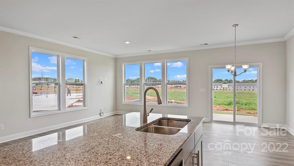 70 Creekview Road Hendersonville, NC 28792 - Photo 10 of 27 a kitchen with granite countertop a sink and a window