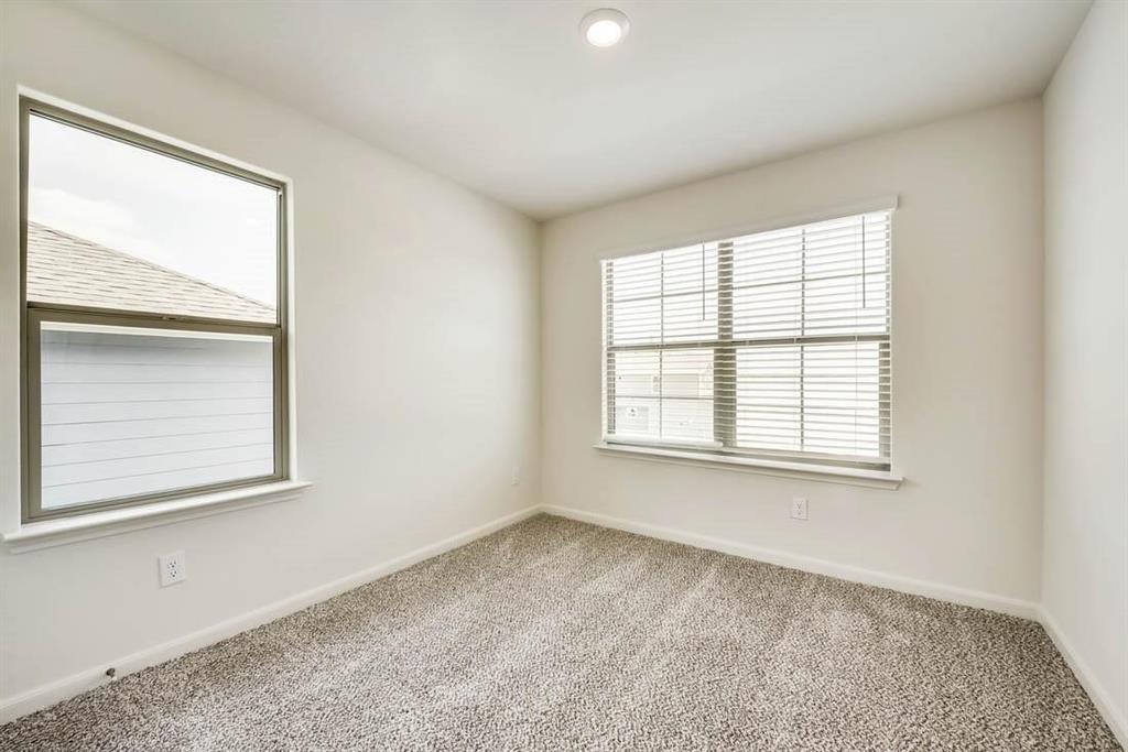 1226 Parker Drive Princeton, TX 75407 - Photo 24 of 35 Carpeted empty room with baseboards