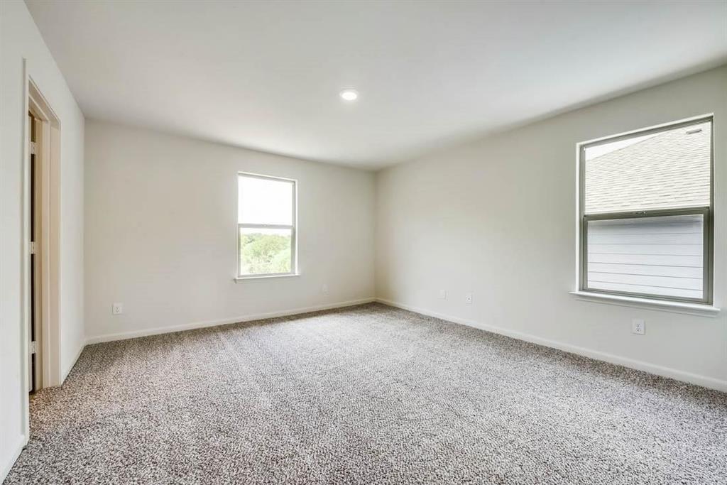 1226 Parker Drive Princeton, TX 75407 - Photo 6 of 35 Unfurnished room featuring light colored carpet and recessed lighting