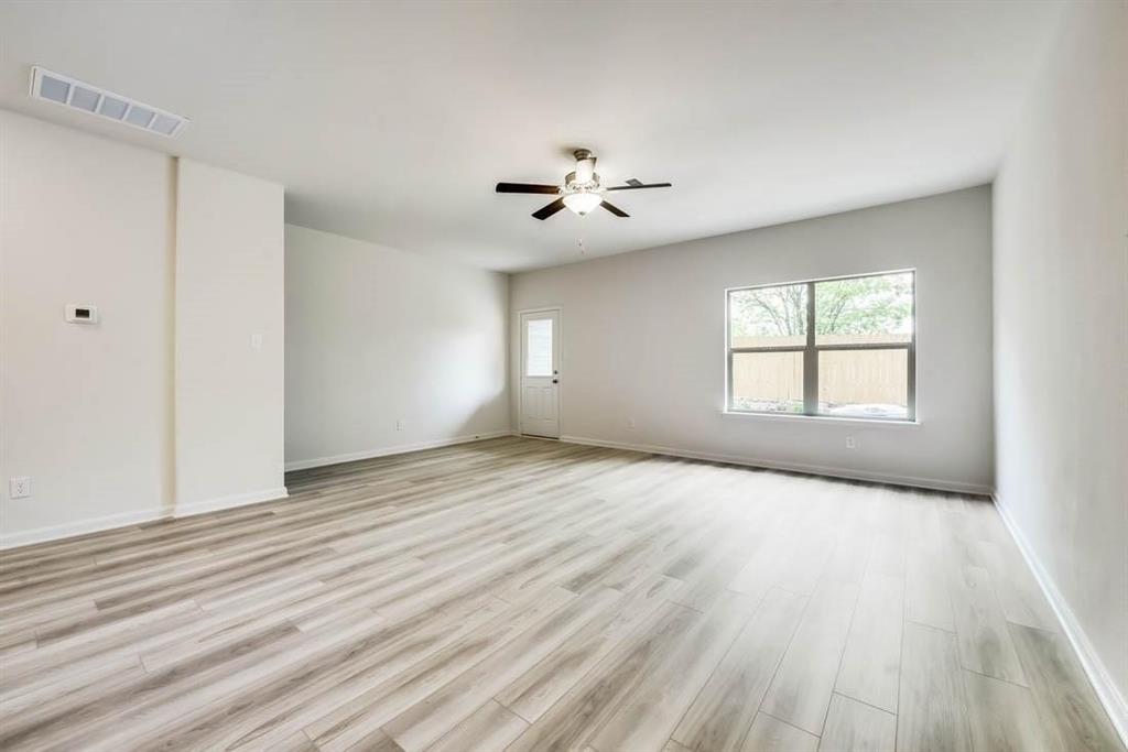 1226 Parker Drive Princeton, TX 75407 - Photo 8 of 35 Spare room featuring light wood finished floors and ceiling fan