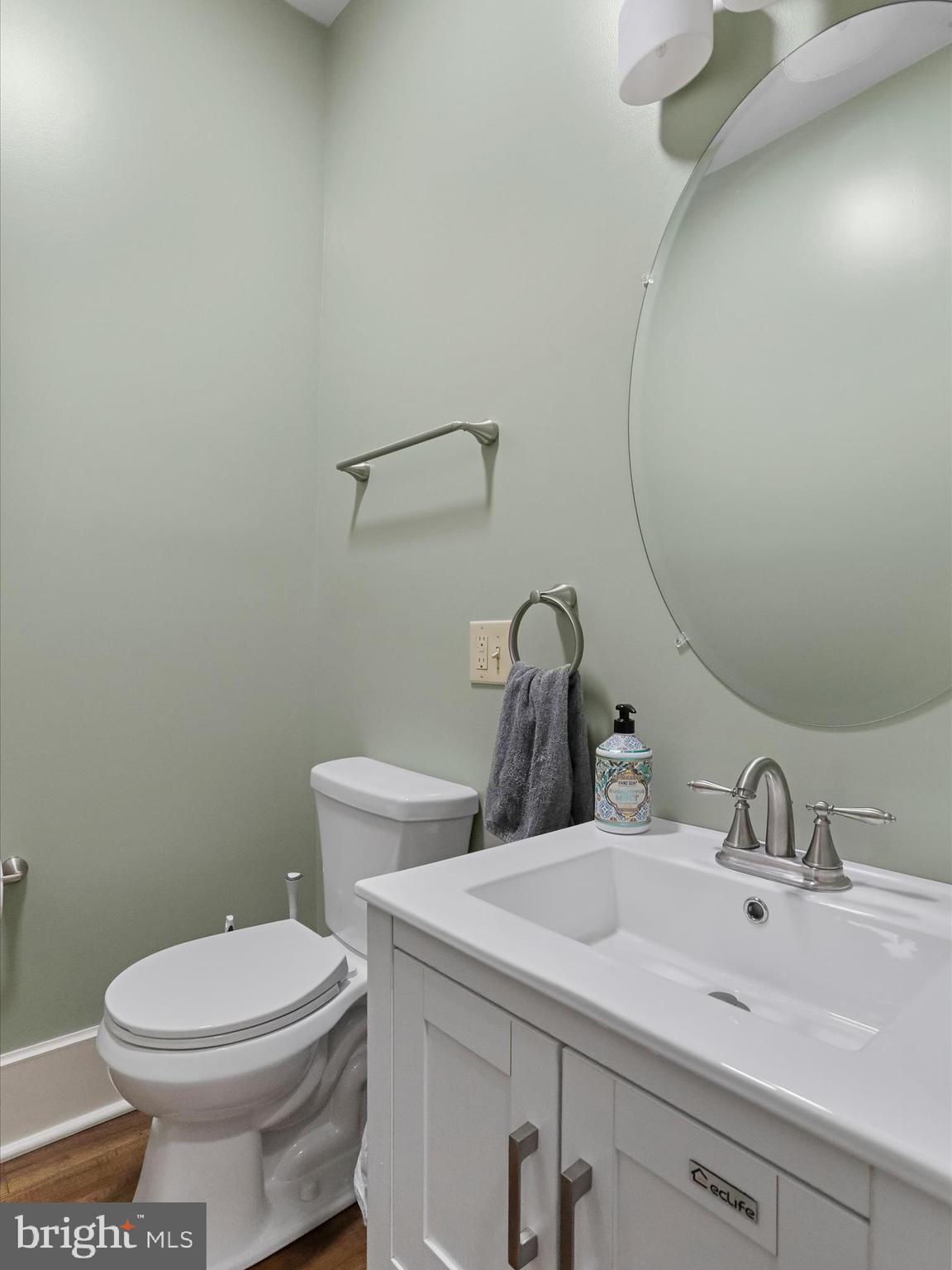 504 Prince George Street Cumberland, MD 21502 - Photo 19 of 33 a bathroom with a toilet sink and mirror