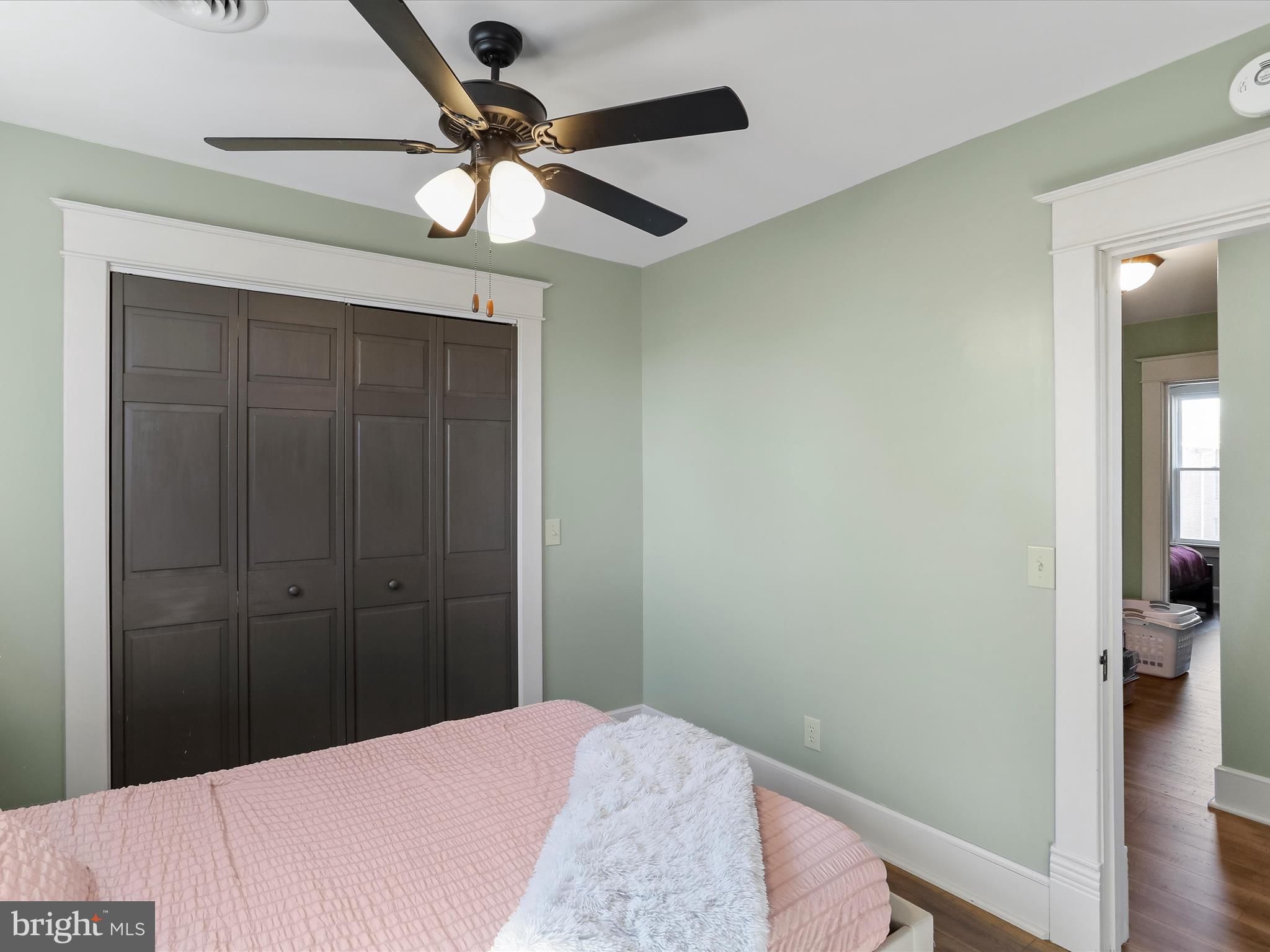 504 Prince George Street Cumberland, MD 21502 - Photo 23 of 33 a bedroom with a bed and a chandelier