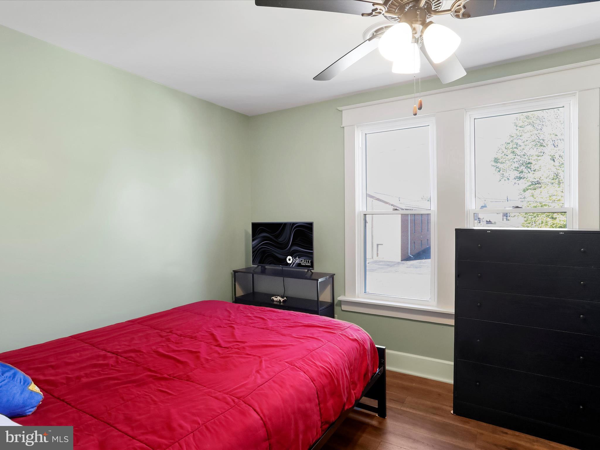 504 Prince George Street Cumberland, MD 21502 - Photo 24 of 33 a bedroom with a bed and a flat screen tv