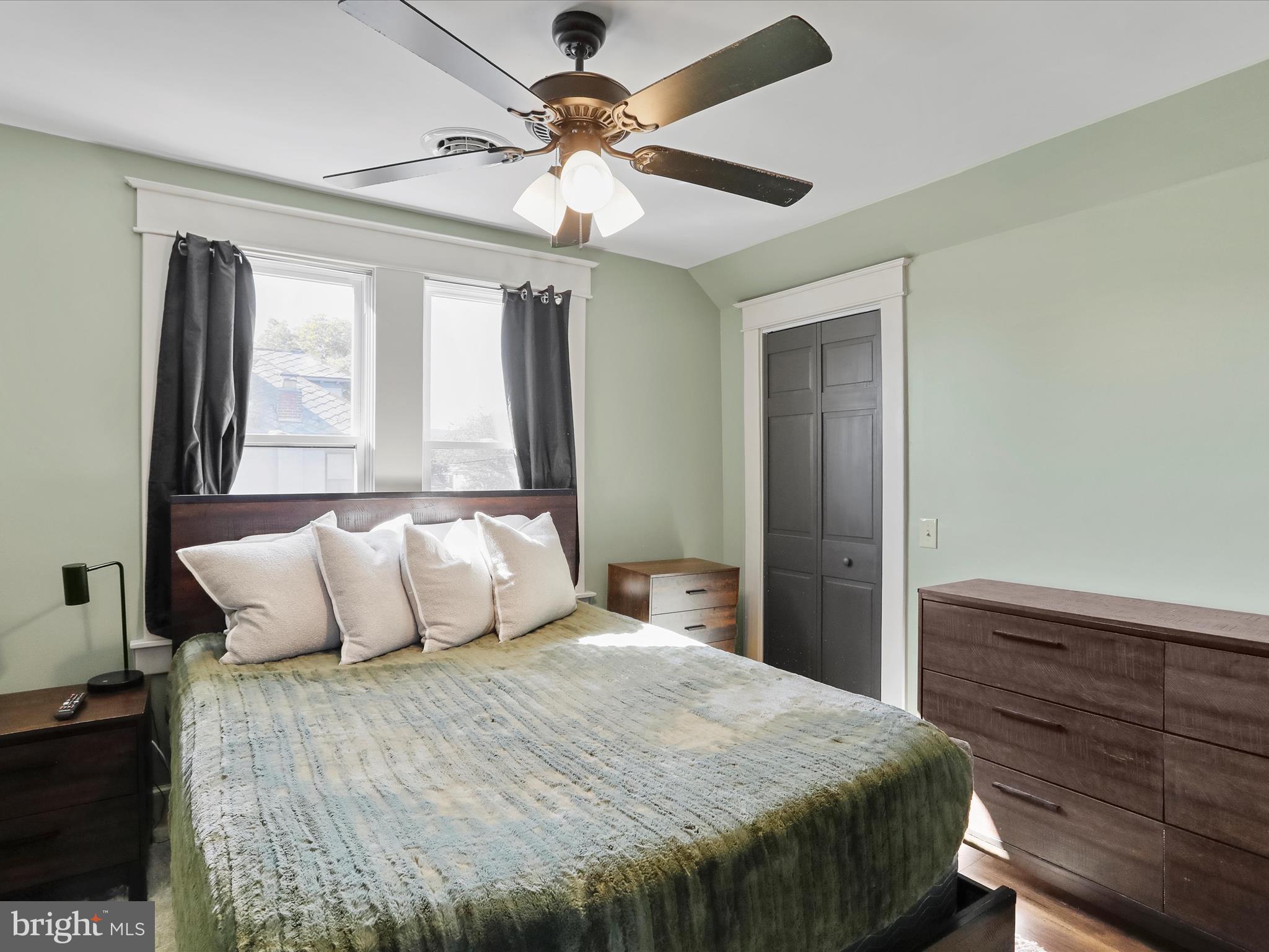 504 Prince George Street Cumberland, MD 21502 - Photo 26 of 33 a bedroom with a large bed and a chandelier