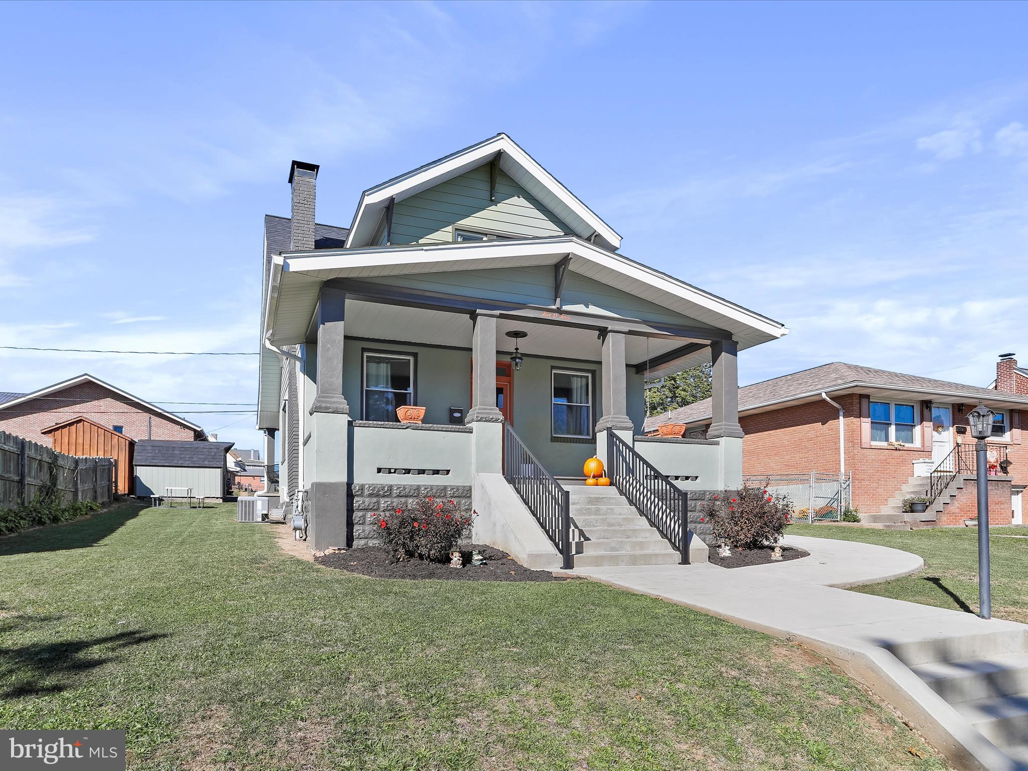 504 Prince George Street Cumberland, MD 21502 - Photo 5 of 33 a front view of a house with a yard