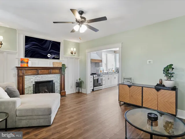a bedroom with furniture and wooden floor