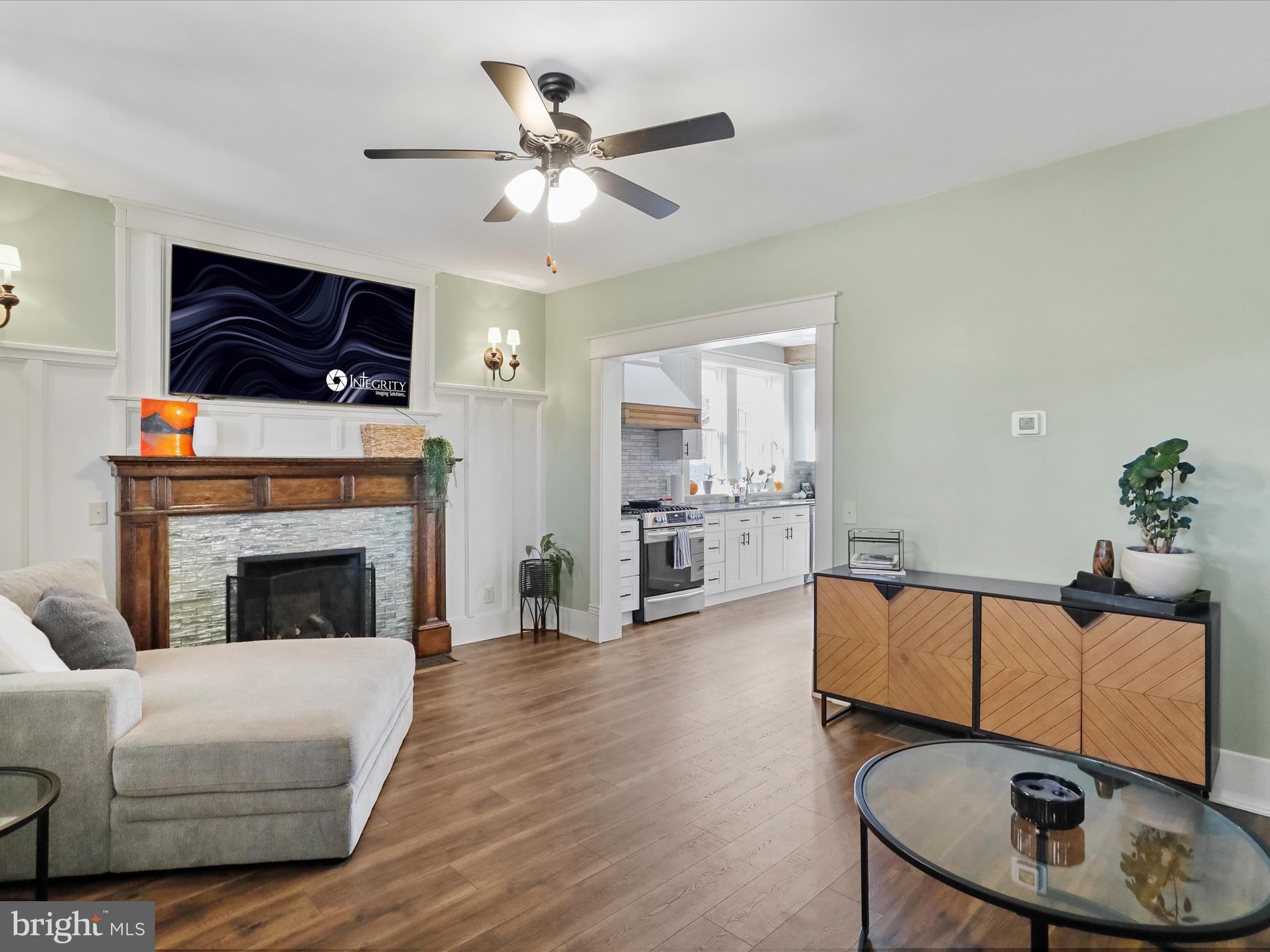 504 Prince George Street Cumberland, MD 21502 - Photo 9 of 33 a living room with furniture and a fireplace